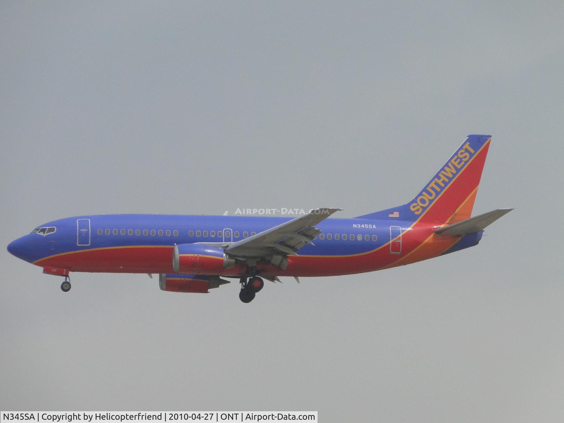 N345SA, 1987 Boeing 737-3K2 C/N 23786, On final to a foggy runway 26R