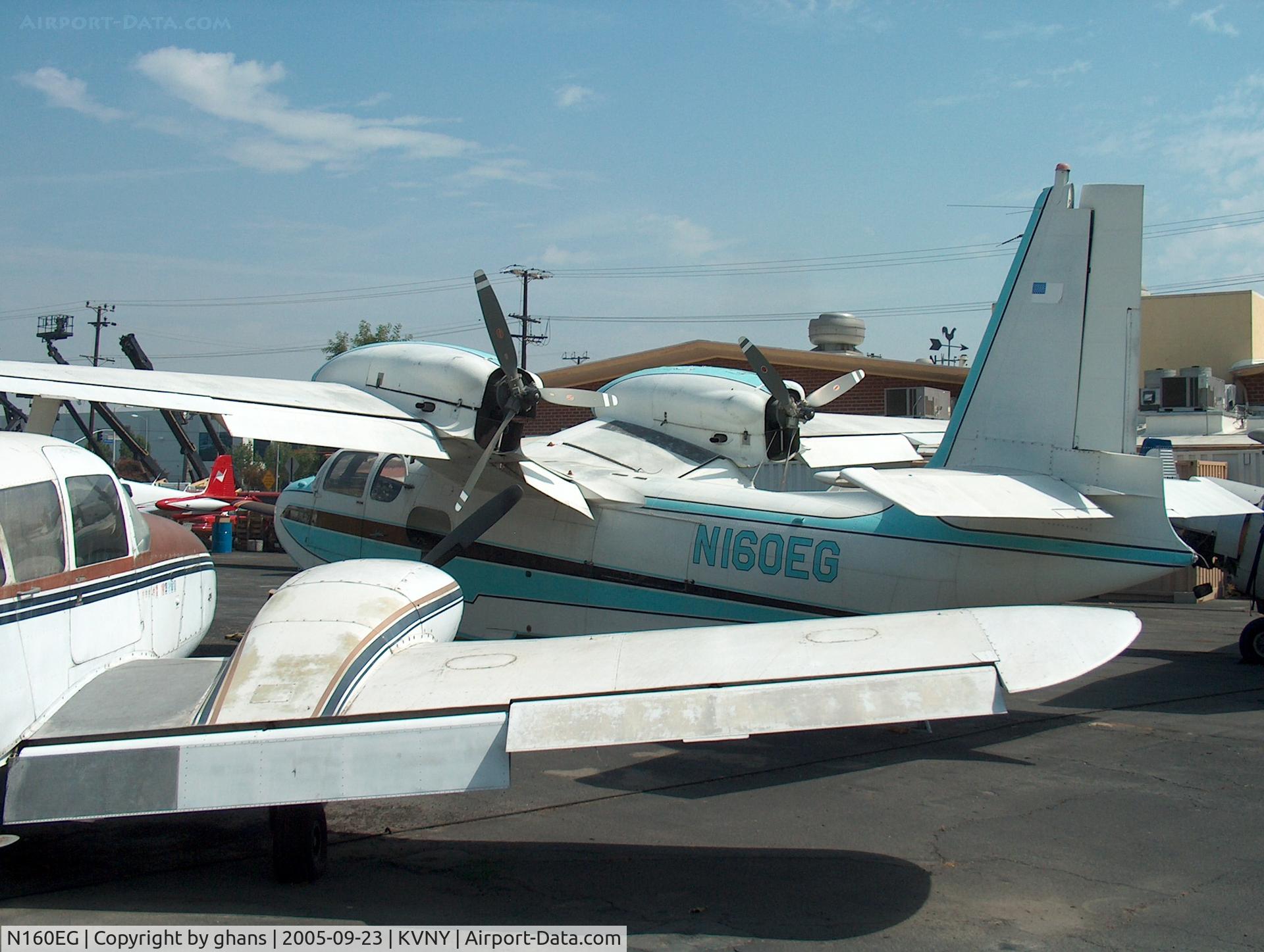 N160EG, 1956 Piaggio P.136-L1 C/N 206, Hiding between some other aircraft.