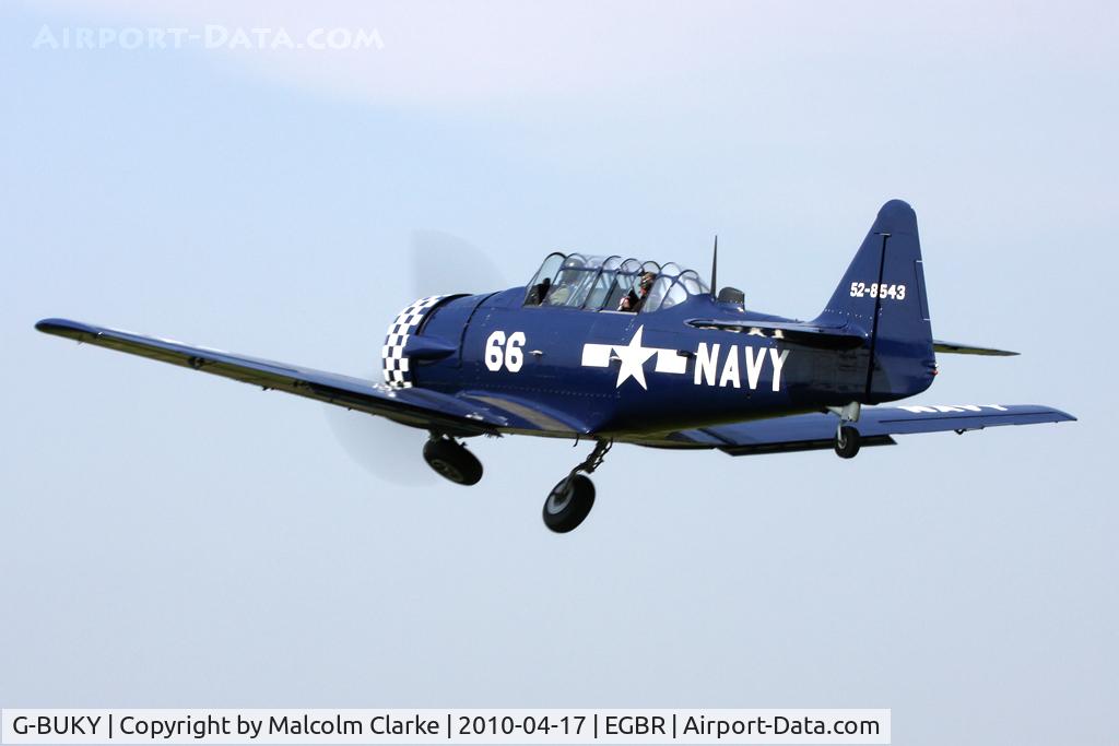 G-BUKY, 1952 Canadian Car & Foundry T-6H Harvard Mk.4M C/N CCF4-464, CCF T-6J Harvard Mk4. 'Wheels up' on take-off at Breighton Airfield, UK in 2010.