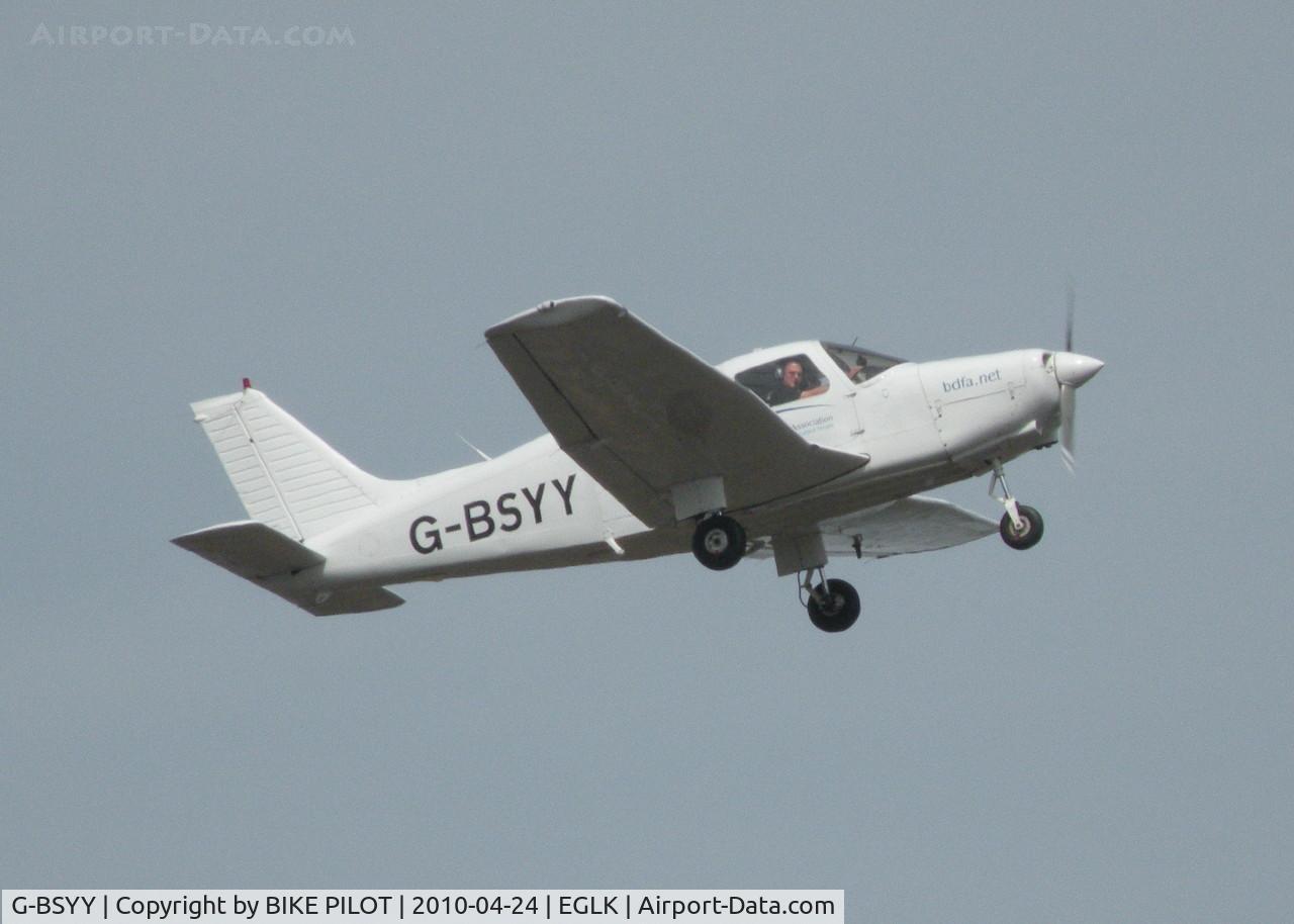 G-BSYY, 1986 Piper PA-28-161 Cherokee Warrior II C/N 2816009, YANKEE YANKEE CLIMBOUT FROM RWY 07