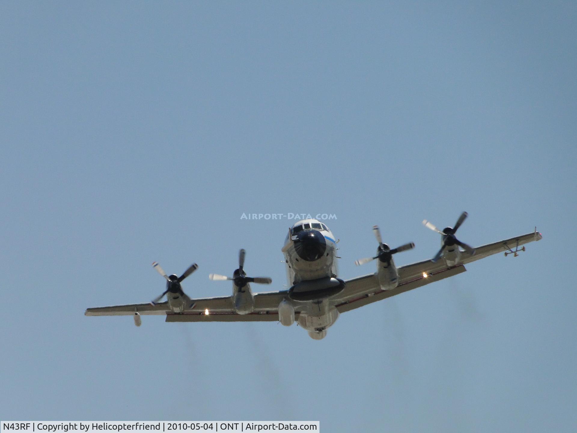N43RF, Lockheed WP-3D Orion C/N 285A-5633, Appears to be smiling after lifting off from runway 26L