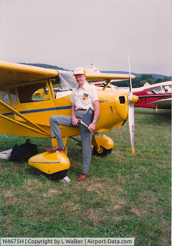 N4675H, 1948 Piper PA-17 Vagabond C/N 15-374, Clyde Smith Piper test pilot at New Haven wiping his feet on 4675H
