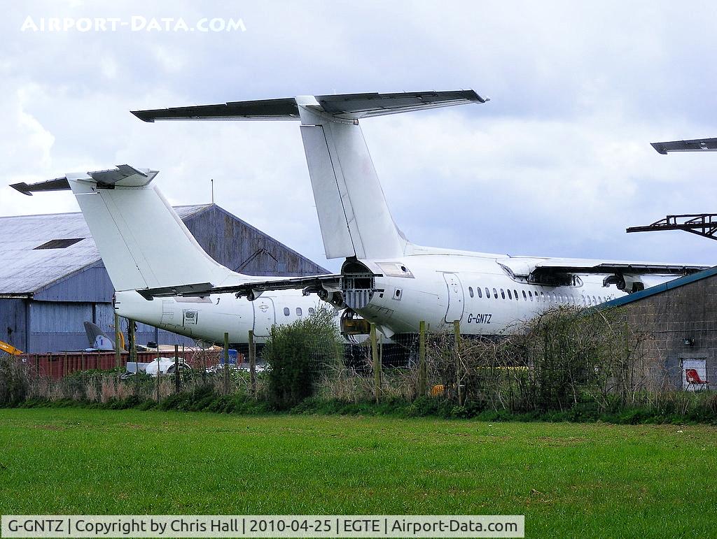 G-GNTZ, 1984 British Aerospace BAe.146-200A C/N E2036, in storage at Exeter Airport alongside G-MANS