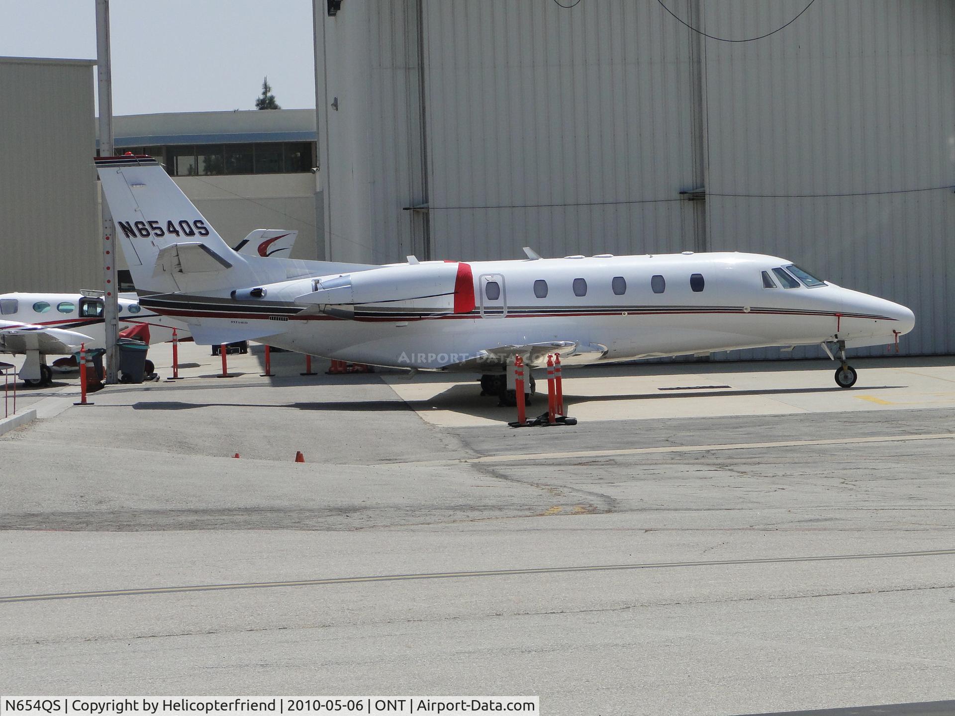 N654QS, 2006 Cessna 560XL C/N 560-5611, Parked and engines covered at Ontario