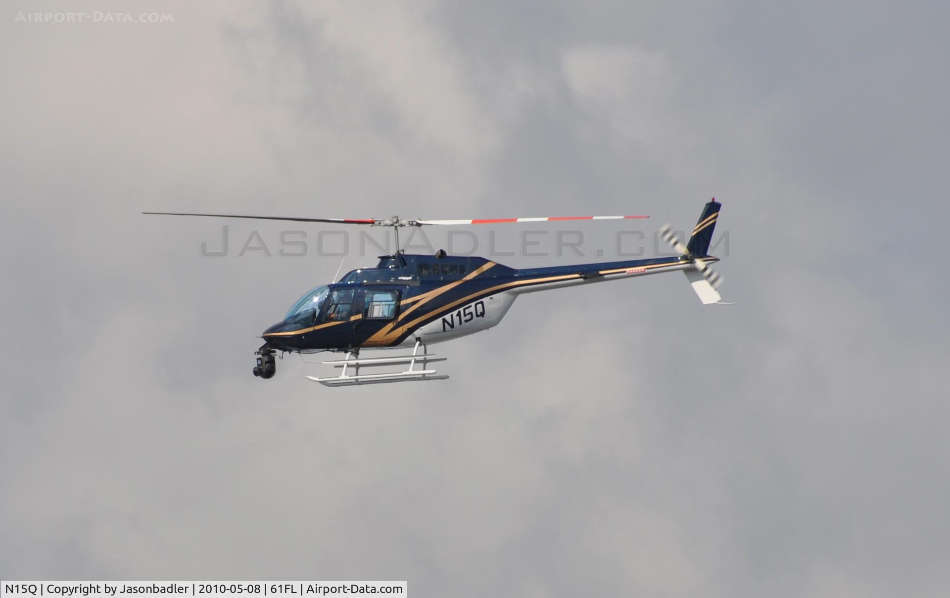 N15Q, Bell 206B JetRanger III C/N 2235, I shot this aircraft which was hovering around the Tampa Convention Center in downtown Tampa. I'm not sure what was going on, but I am assuming that some people were looking about buying this aircraft, but who knows.
