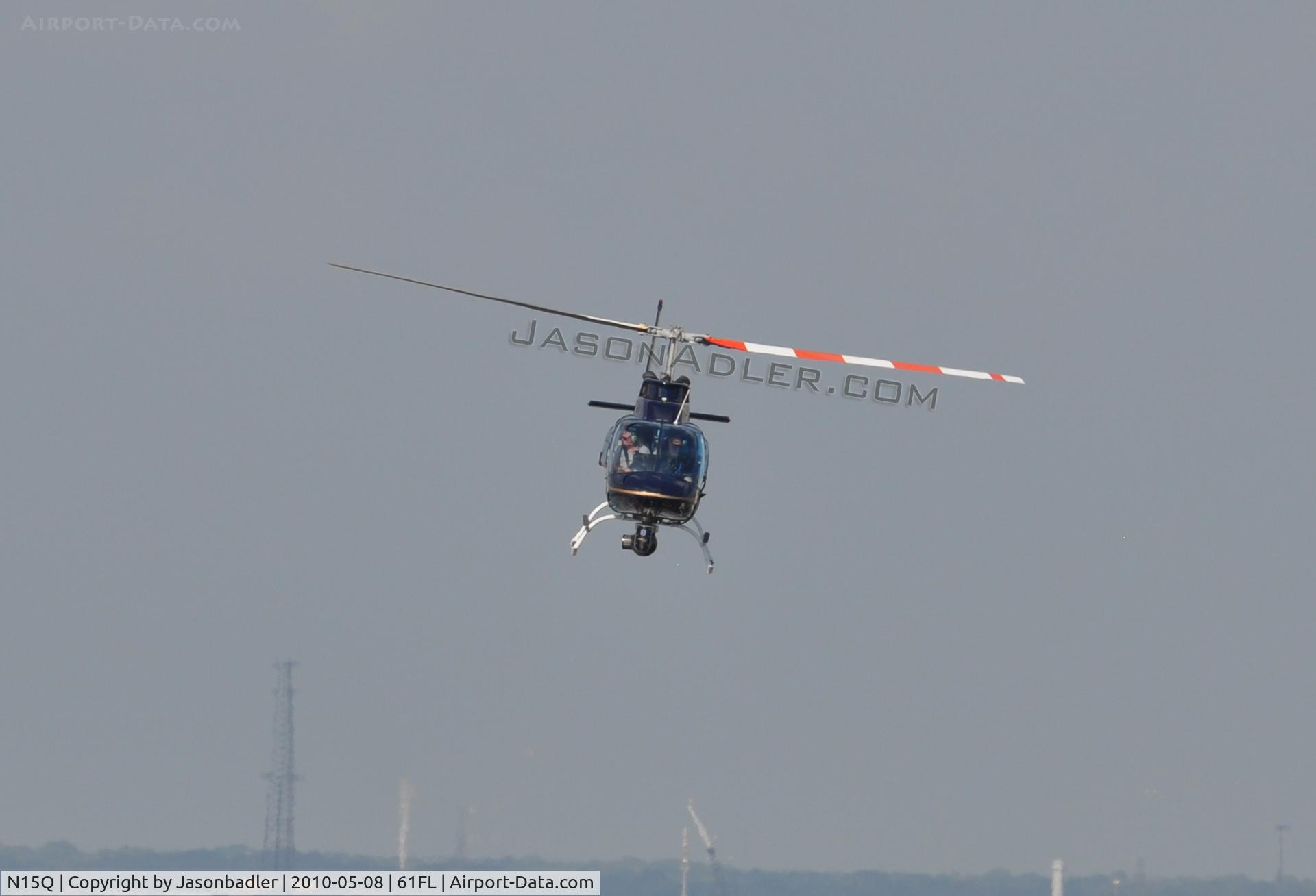 N15Q, Bell 206B JetRanger III C/N 2235, I shot this aircraft which was hovering around the Tampa Convention Center in downtown Tampa. I'm not sure what was going on, but I am assuming that some people were looking about buying this aircraft, but who knows.
