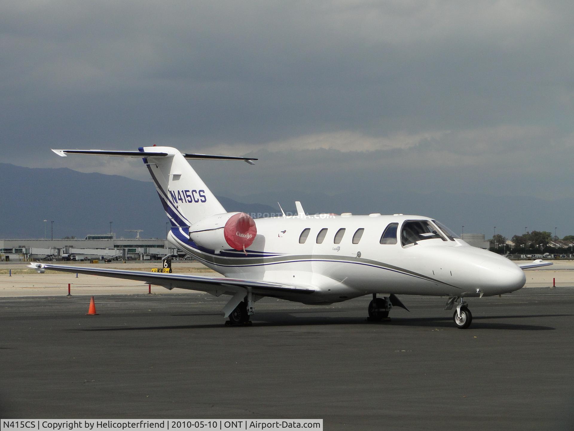 N415CS, 2000 Cessna 525 C/N 525-0373, Parked and engines covered from the wind and debris