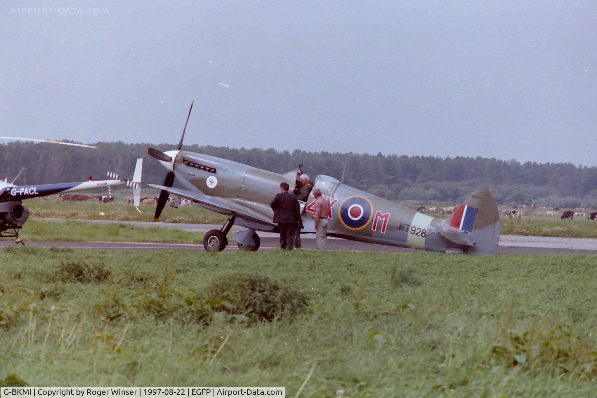 G-BKMI, 1944 Supermarine 359 Spitfire HF.VIIIc C/N 6S/583793, Representing aircraft MT928/ZX-M at the official opening of Pembrey Airport in 1997.