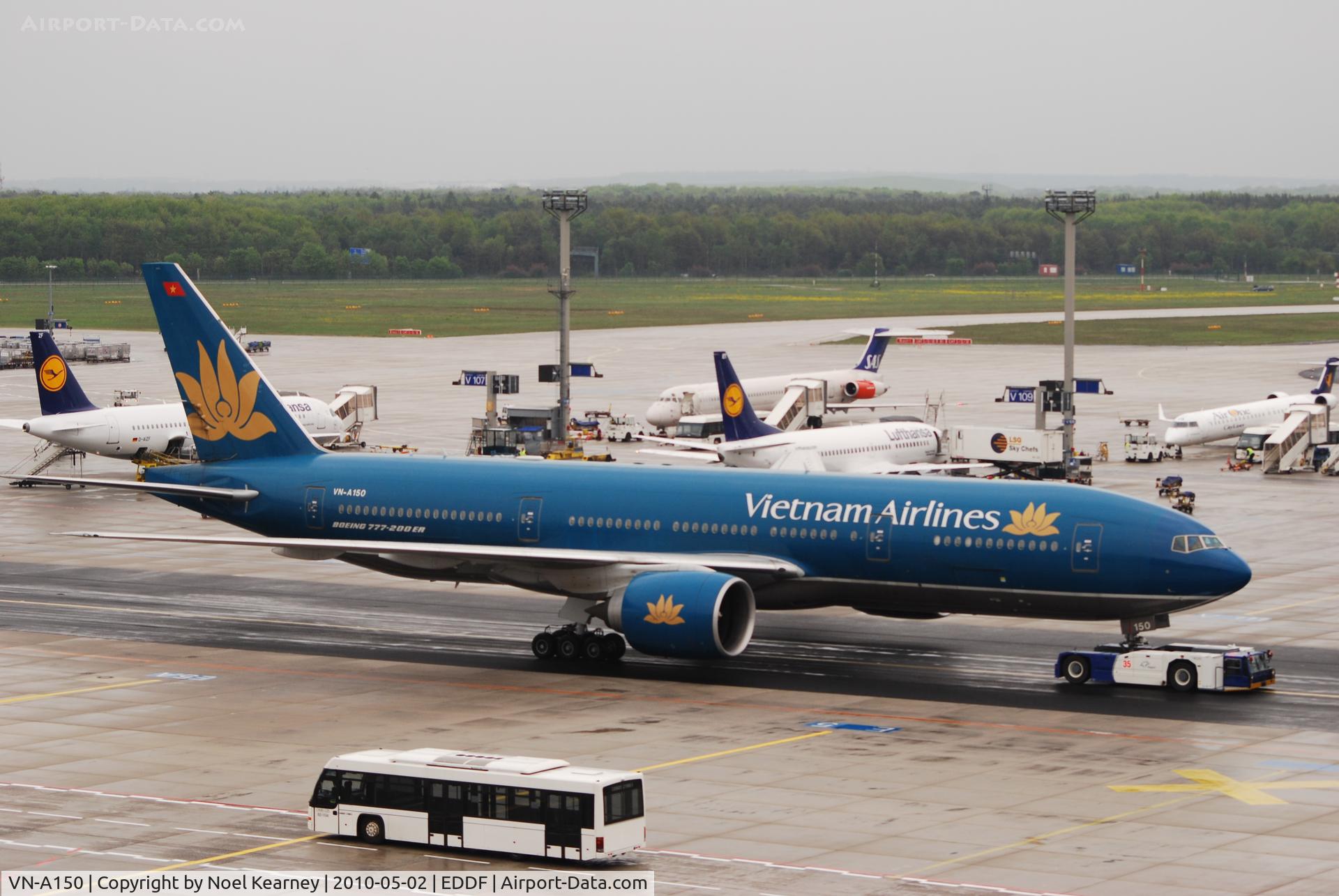 VN-A150, 2005 Boeing 777-2Q8/ER C/N 32717, Being towed onto stand..