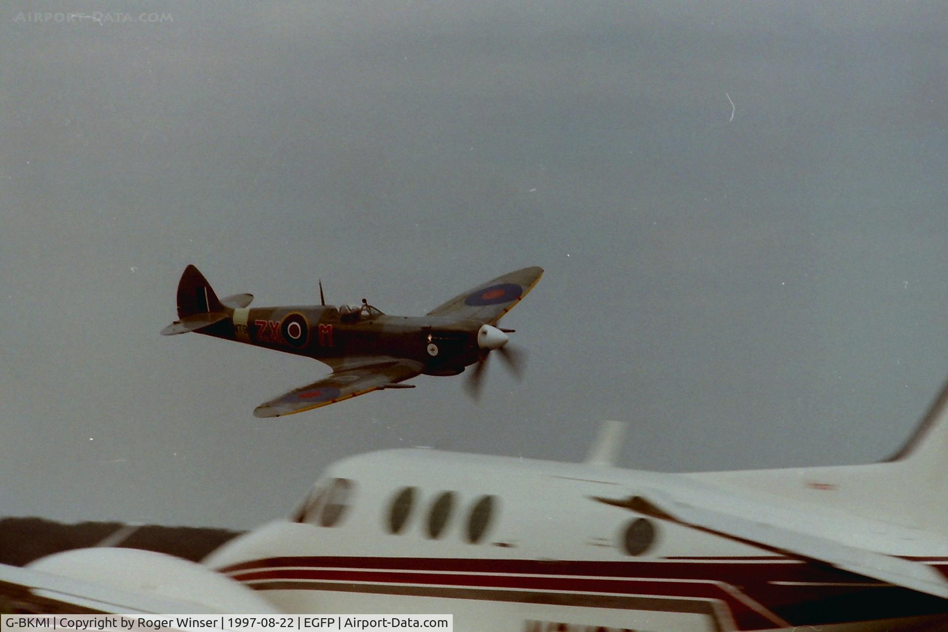 G-BKMI, 1944 Supermarine 359 Spitfire HF.VIIIc C/N 6S/583793, Marked as MT928/ZX-M of 145 Squadron RAF. Low pass at the official opening of Pembrey Airport in 1997