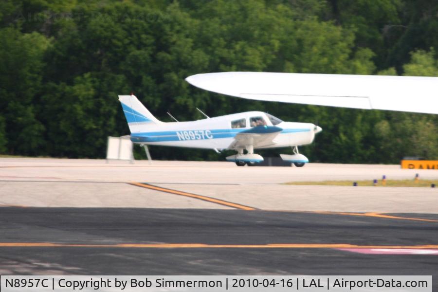 N8957C, 1976 Piper PA-28-140 Cherokee C/N 28-7625137, Departing Lakeland, FL during Sun N Fun 2010