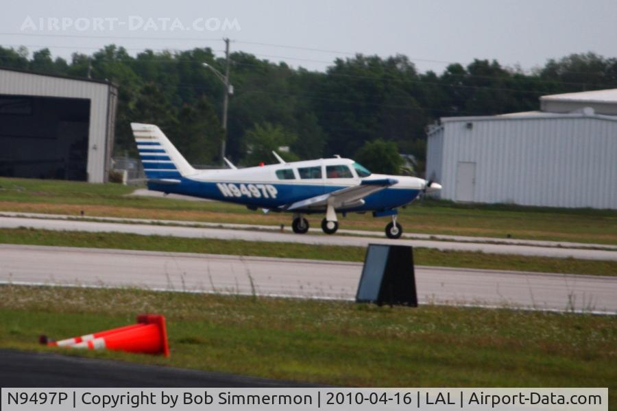 N9497P, 1972 Piper PA-24-260 C/N 24-5015, Departing Lakeland, FL during Sun N Fun 2010