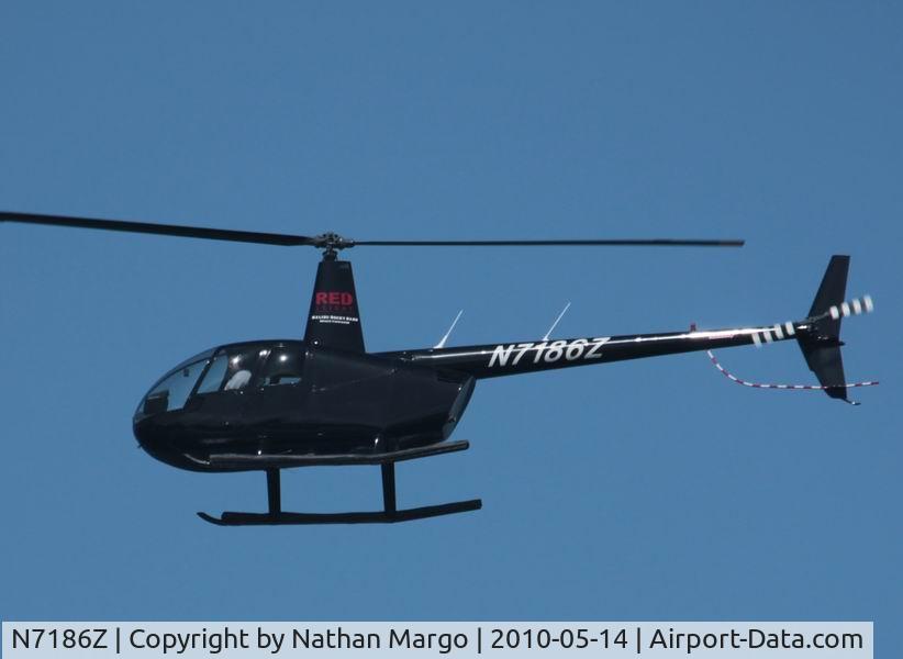 N7186Z, 2000 Robinson R44 C/N 0737, Seen flying over O.B. Pier, San Diego, CA