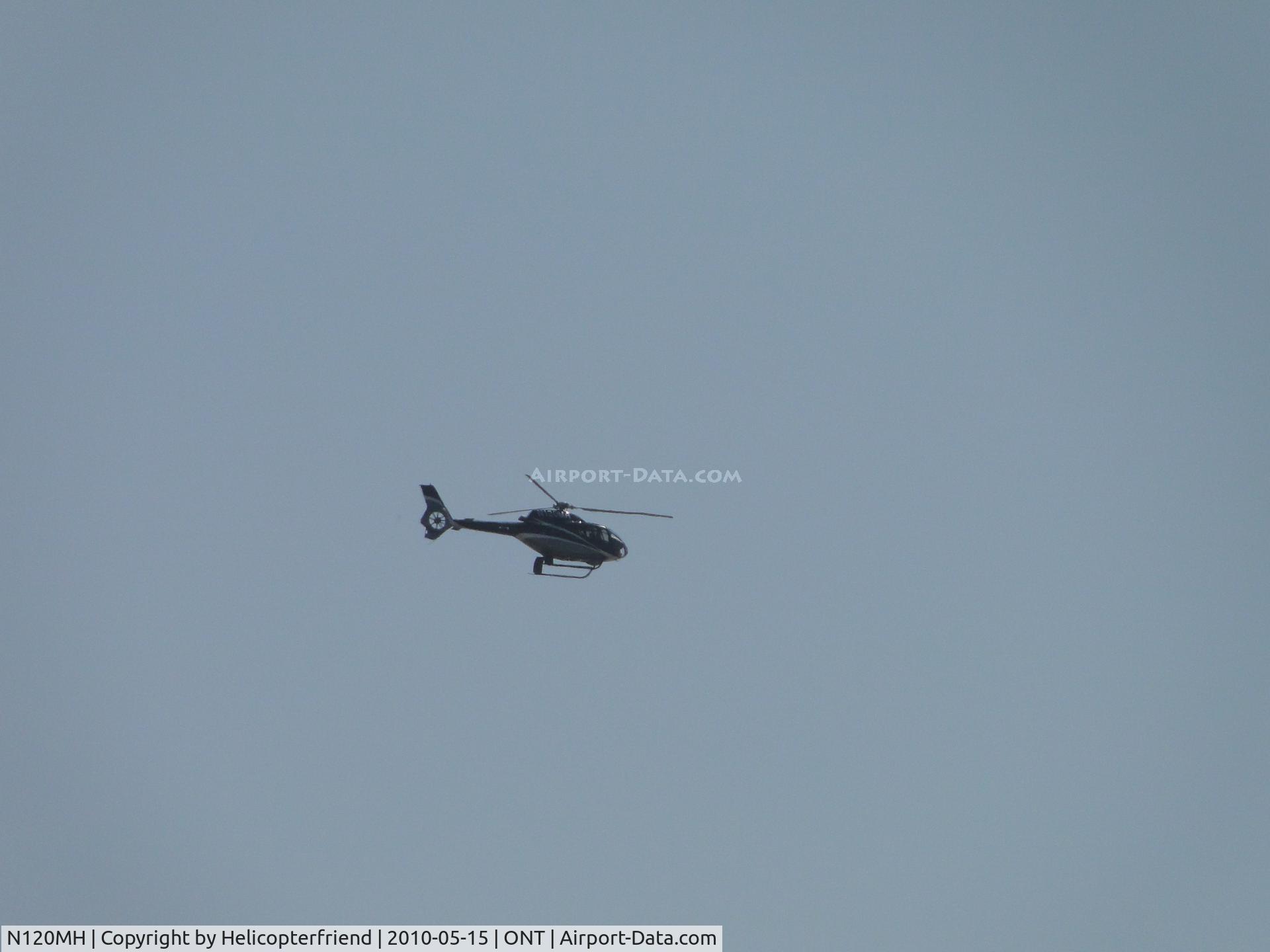 N120MH, 2004 Eurocopter EC-120B Colibri C/N 1390, A little over a mile south of runway 26L travelling westbound