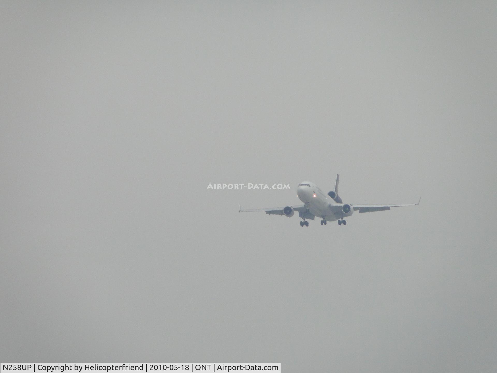 N258UP, 1991 McDonnell Douglas MD-11F C/N 48416, Coming out of the soup on final to Ontario