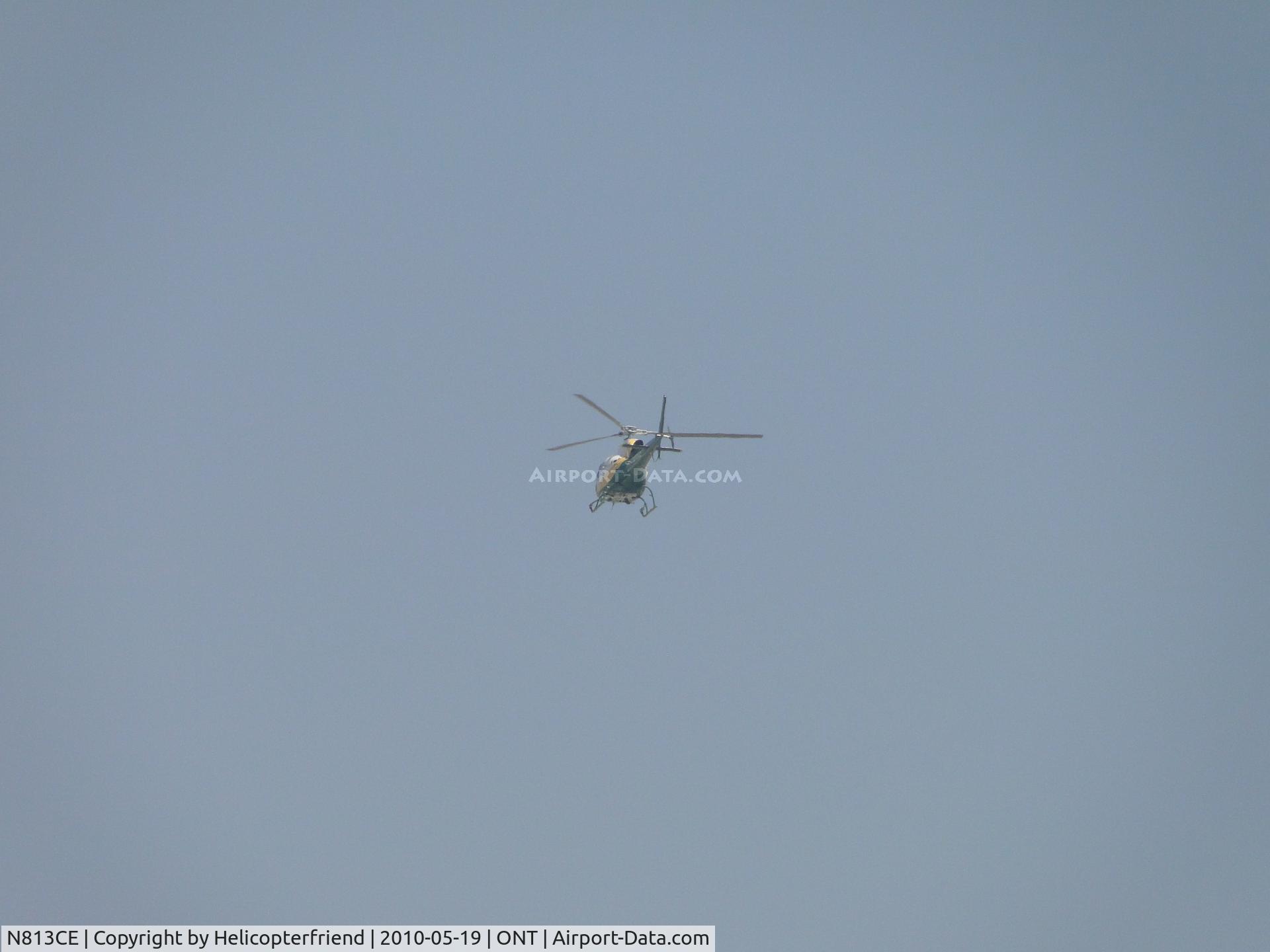 N813CE, 2004 Eurocopter AS-350B-3 Ecureuil Ecureuil C/N 3830, taking off heading northwest from Ontario SCE hanger