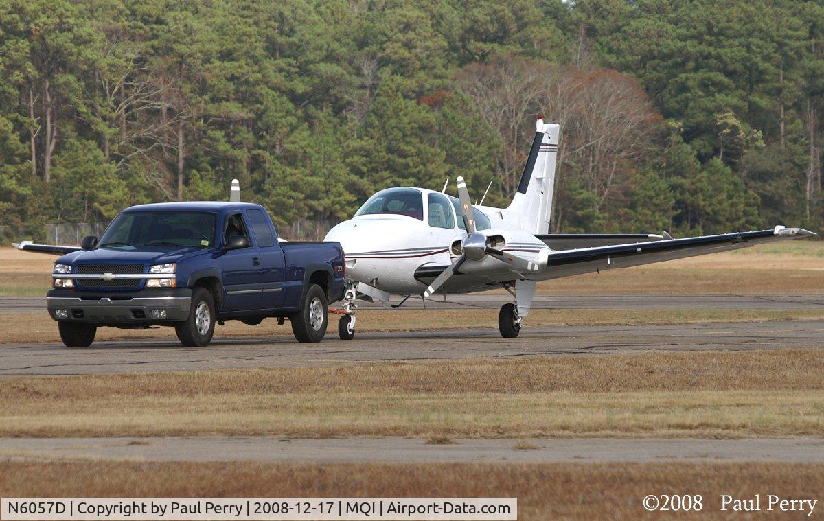 N6057D, 1979 Beech 95-B55 (T42A) Baron C/N TC-2233, Getting a tow across the field