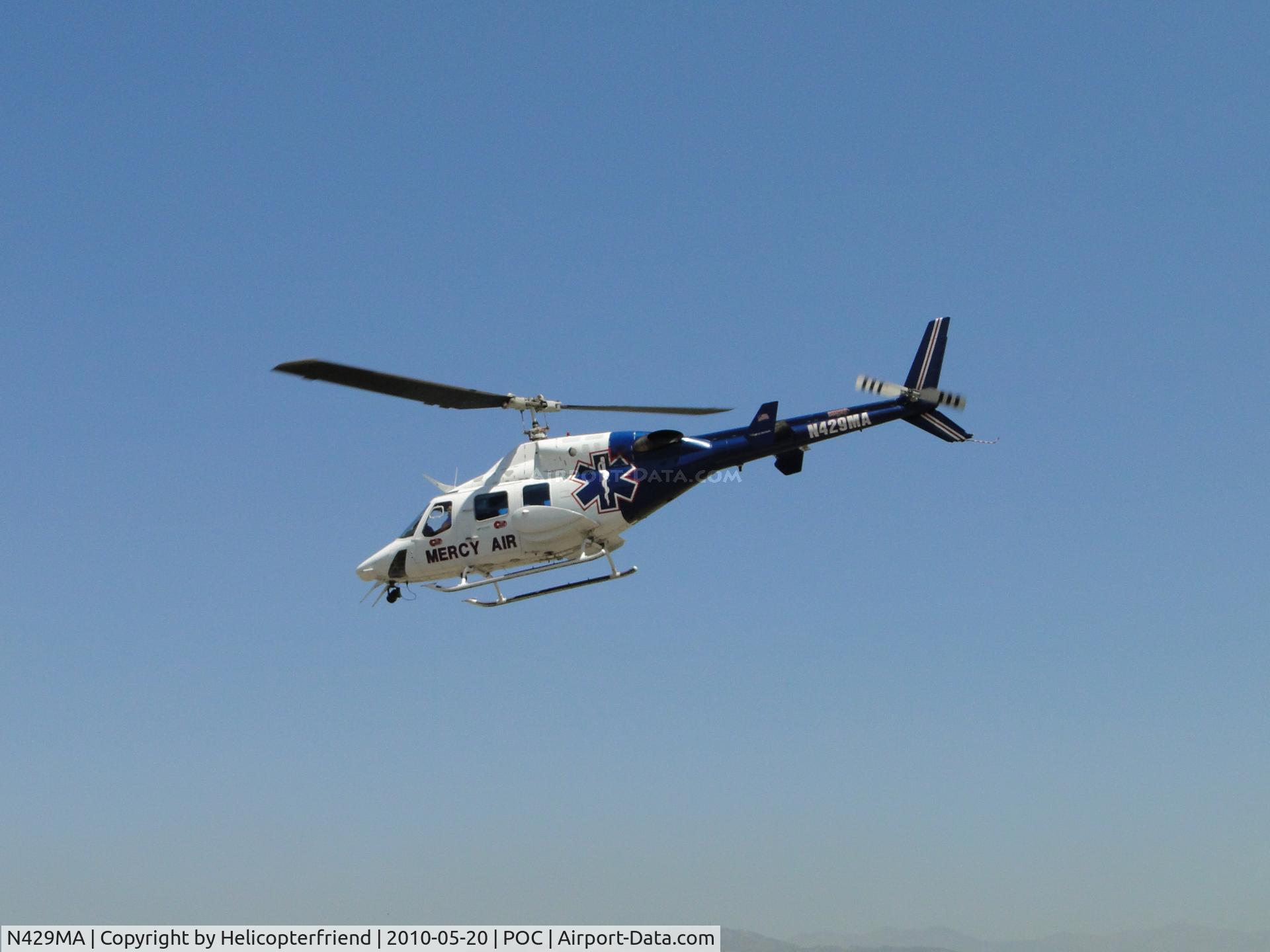 N429MA, 1984 Bell 222UT C/N 47523, Off and heading westbound