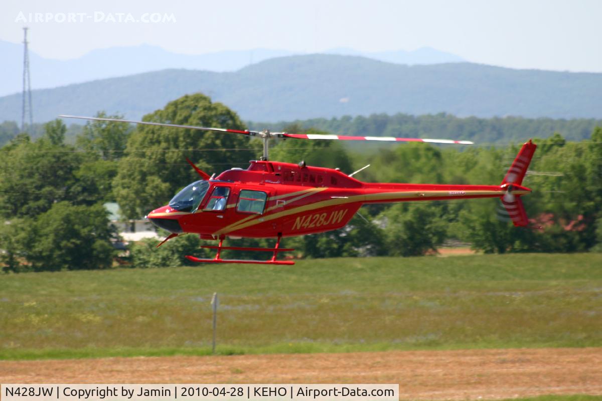 N428JW, 2003 Bell 206B C/N 4572, The quality of the picture isn't the greatest, neither is the lighting, but the paint job on this one warranted an upload.