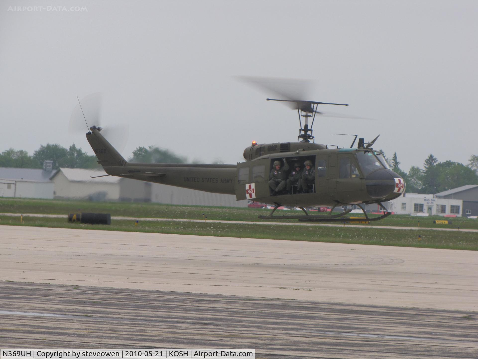 N369UH, 1970 Bell UH-1H C/N 70-16369, Lifting off at Oshkosh WI USA