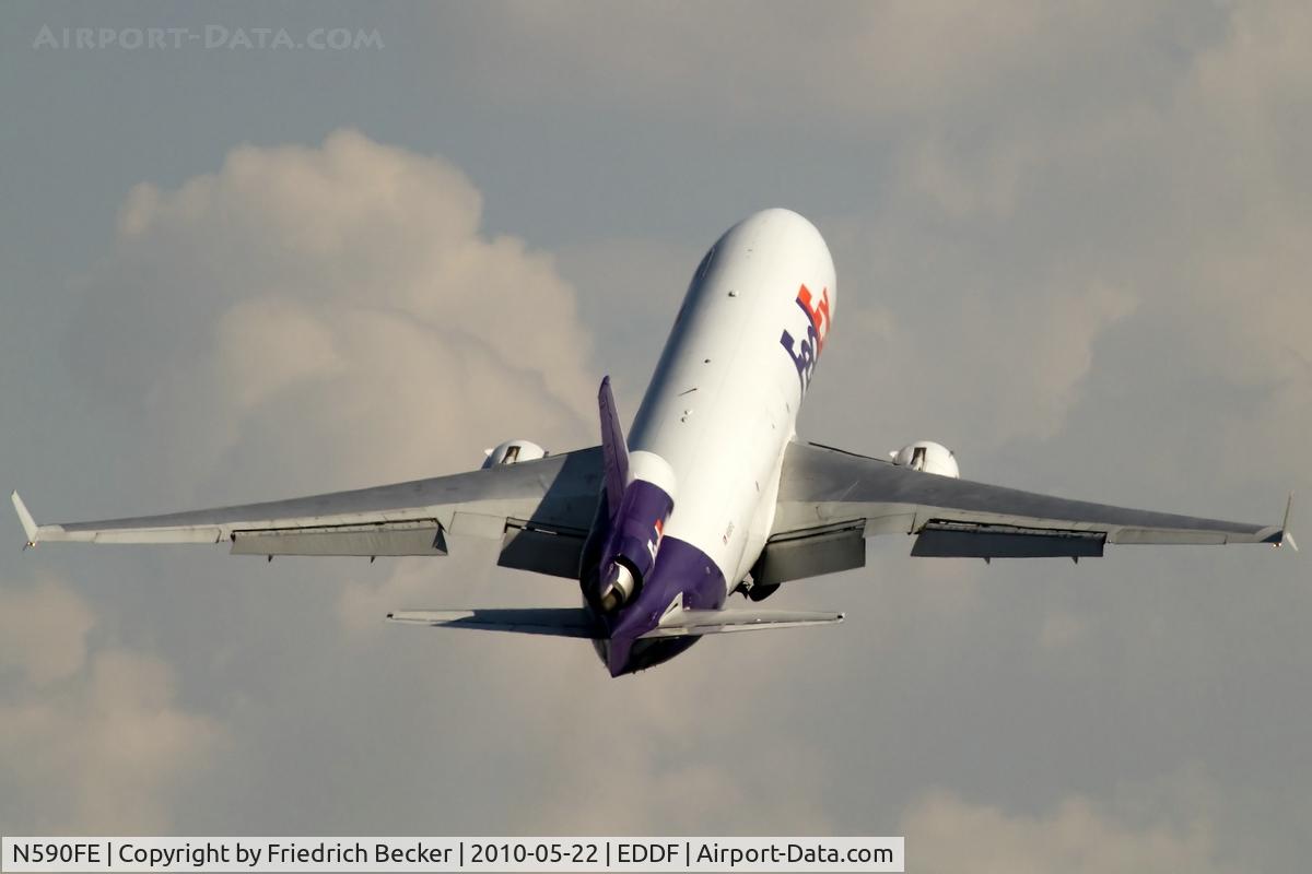 N590FE, 1991 McDonnell Douglas MD-11F C/N 48505, steep RW18W climb out