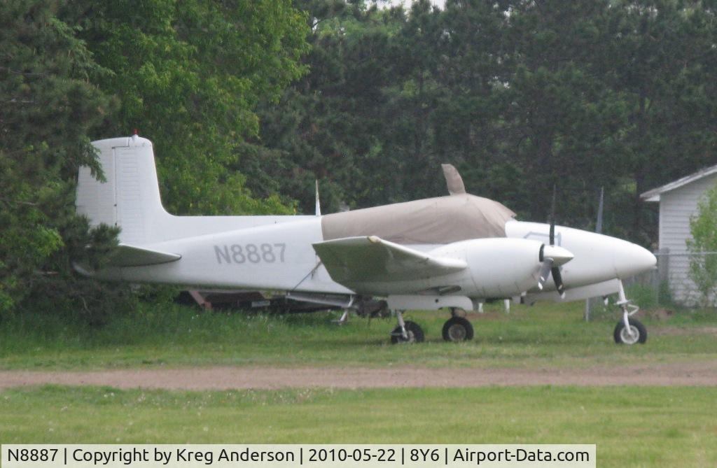 N8887, 1954 Beech B50 C/N CH-84, Tucked away in a corner at 8Y6.