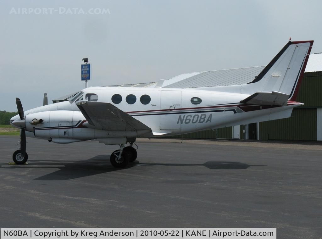 N60BA, Beech E-90 King Air C/N LW-79, Parked on a ramp by one of the FBOs.