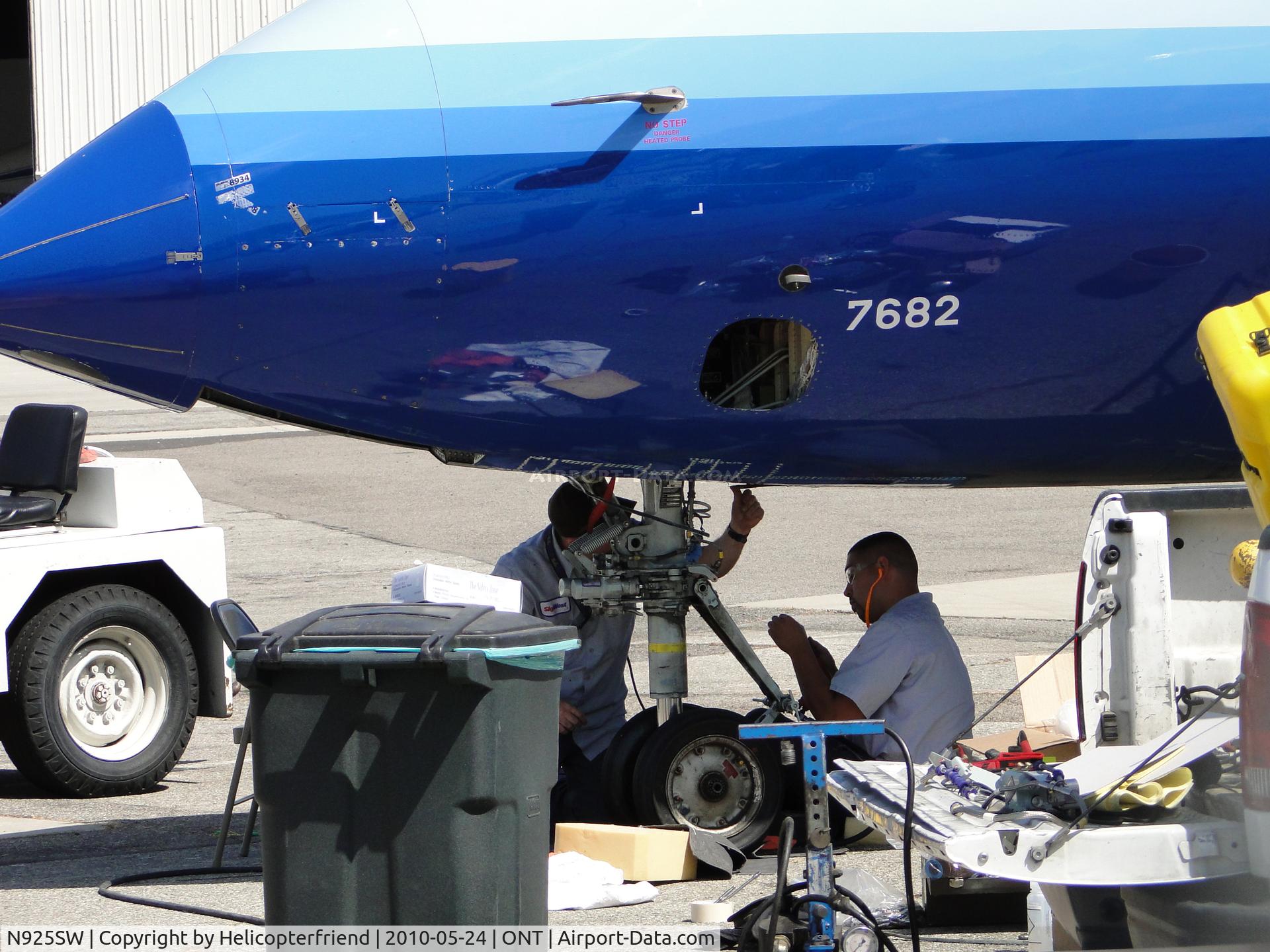 N925SW, 2002 Bombardier CRJ-200LR (CL-600-2B19) C/N 7682, Sky West, United Connector was towed off of runway 26L and nose wheel being repaired