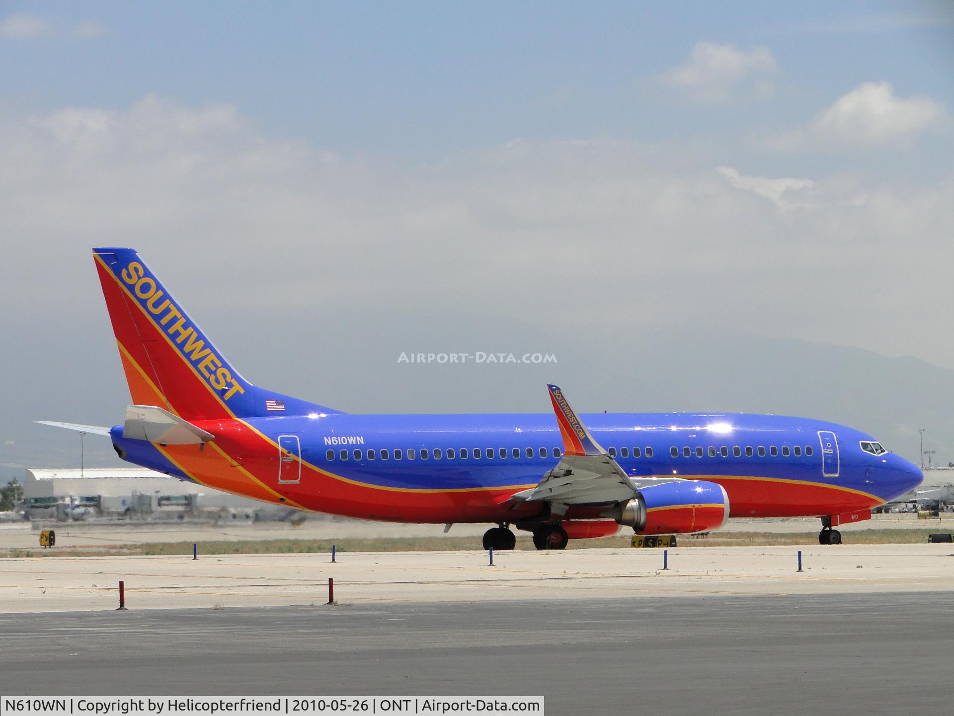 N610WN, 1995 Boeing 737-3H4 C/N 27696, After landing on 26L, awaiting clearence to cross runways 26L & 26R to go to terminal