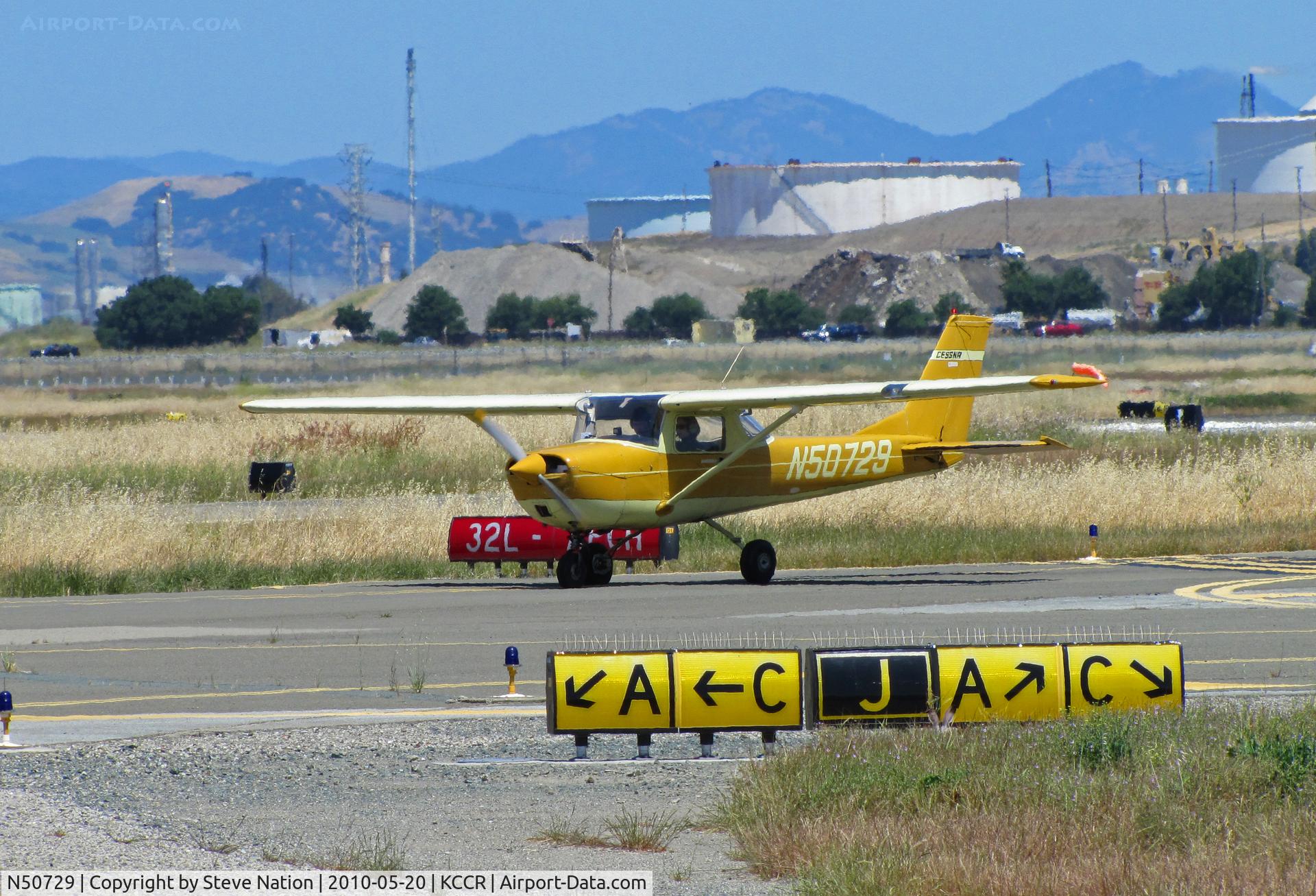 N50729, 1968 Cessna 150J C/N 15069513, Petaluma-based (KO69) 1968 Cessna 150J holding on taxiway with fuel tank farm in background @ Buchanan Field