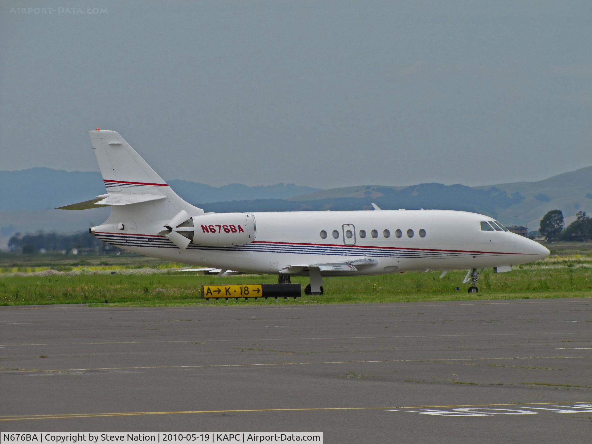N676BA, 2001 Dassault Falcon 2000 C/N 176, 2001 Dassault Falcon 2000 leaving Napa, CA (KAPC) for mystery location with Napa River RR Bridge in background
