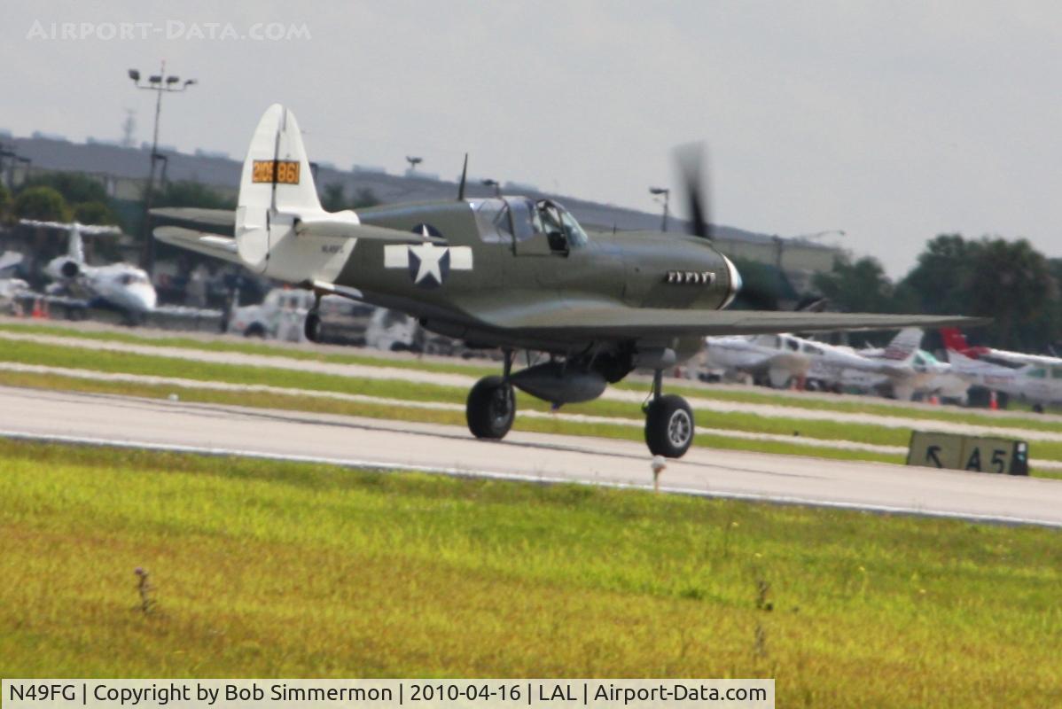 N49FG, 1943 Curtiss P-40N Warhawk C/N 29623, Departing Lakeland, Florida during Sun N Fun 2010.