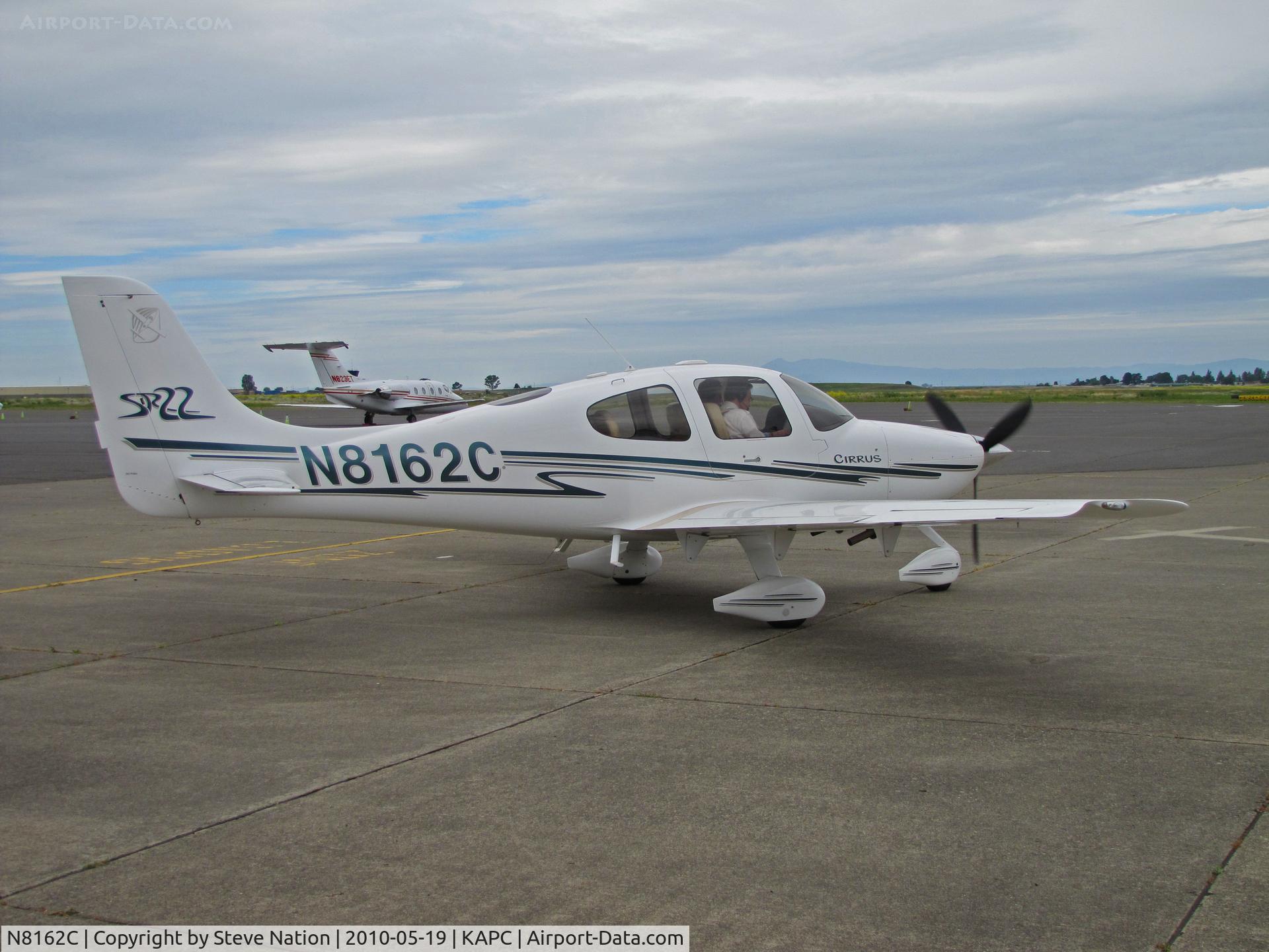 N8162C, 2003 Cirrus SR22 C/N 0645, 2003 Cirrus SR22 taxying past exec jet flight line at Napa, CA