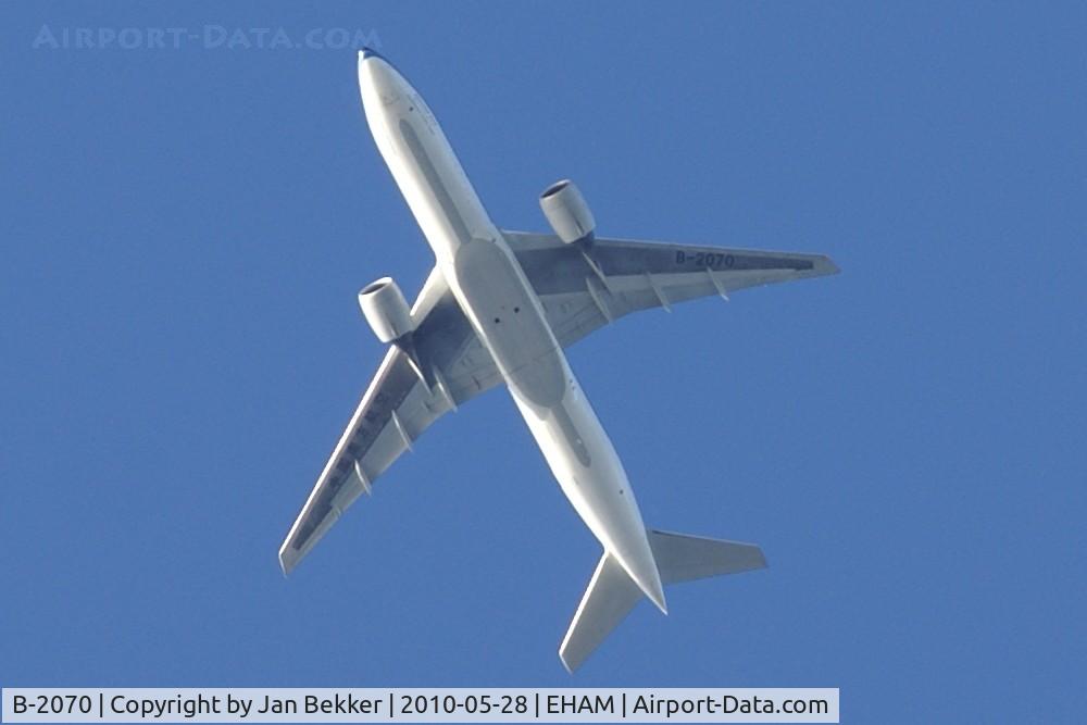B-2070, 2004 Boeing 777-21B (ER) C/N 32703, Flying over Flevoland heading for Amsterdam in the early evening.