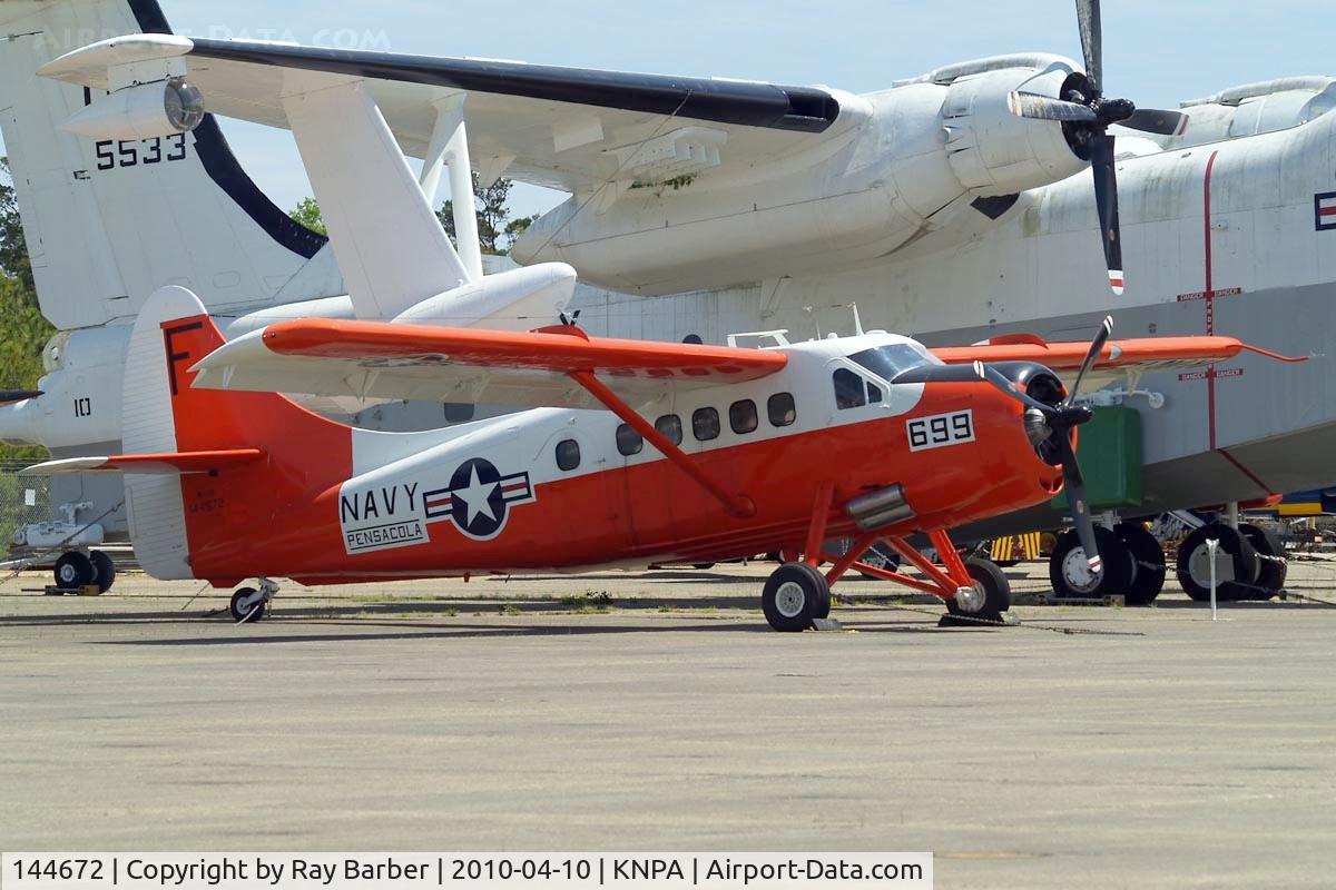 144672, 1956 De Havilland Canada U-1B Otter C/N 160, DHC NU-1B Otter [160] Pensacola NAS~N 10/04/2010. Parked in the storage area of the National Museum of Naval Aviation. Sheltering here under the wing of the Martin SP-5B Marlin.