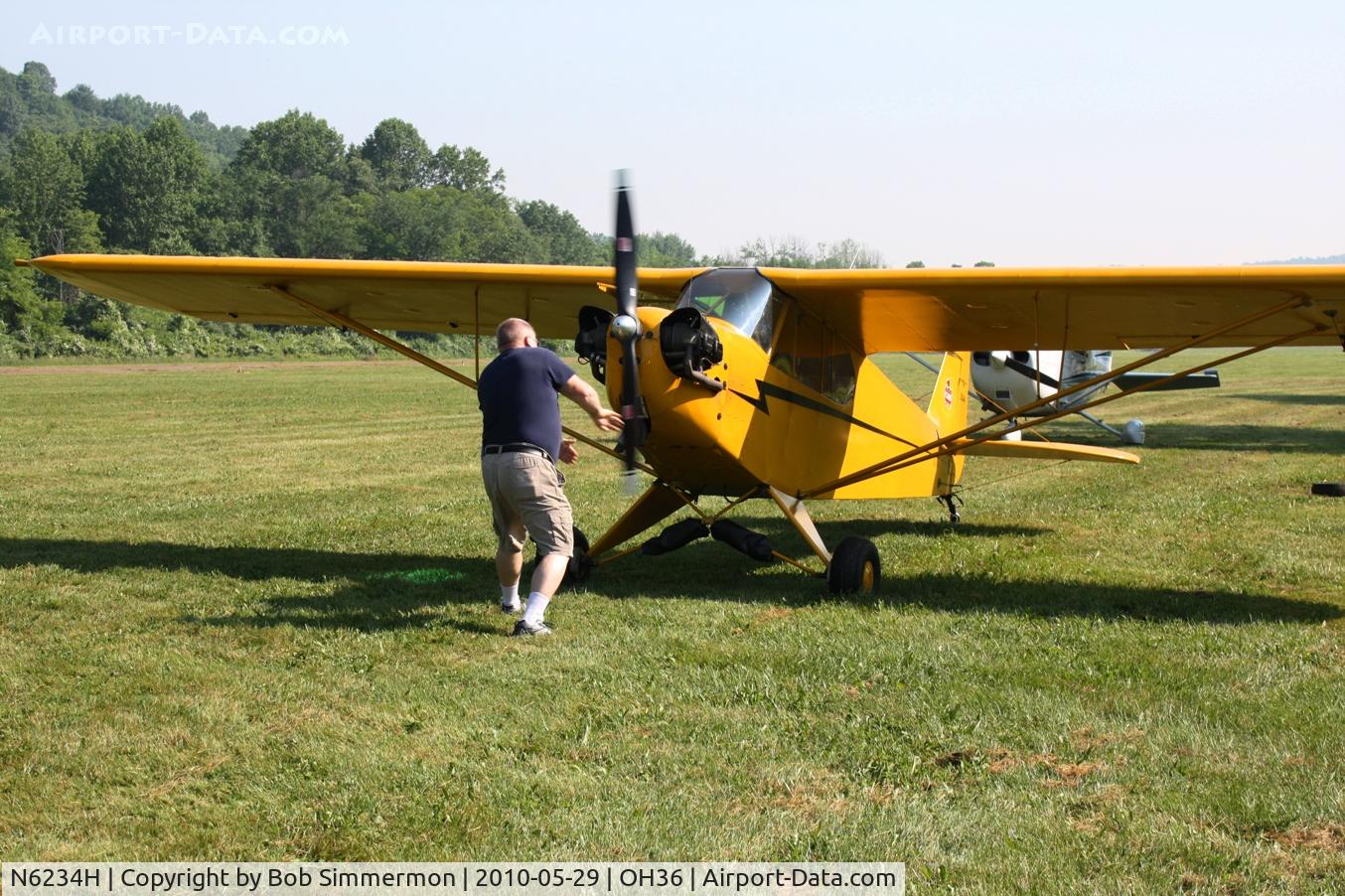 N6234H, 1946 Piper J3C-65 Cub C/N 19408, Hand-prop start for Young Eagle rides at the Zanesville Riverside EAA breakfast fly-in.