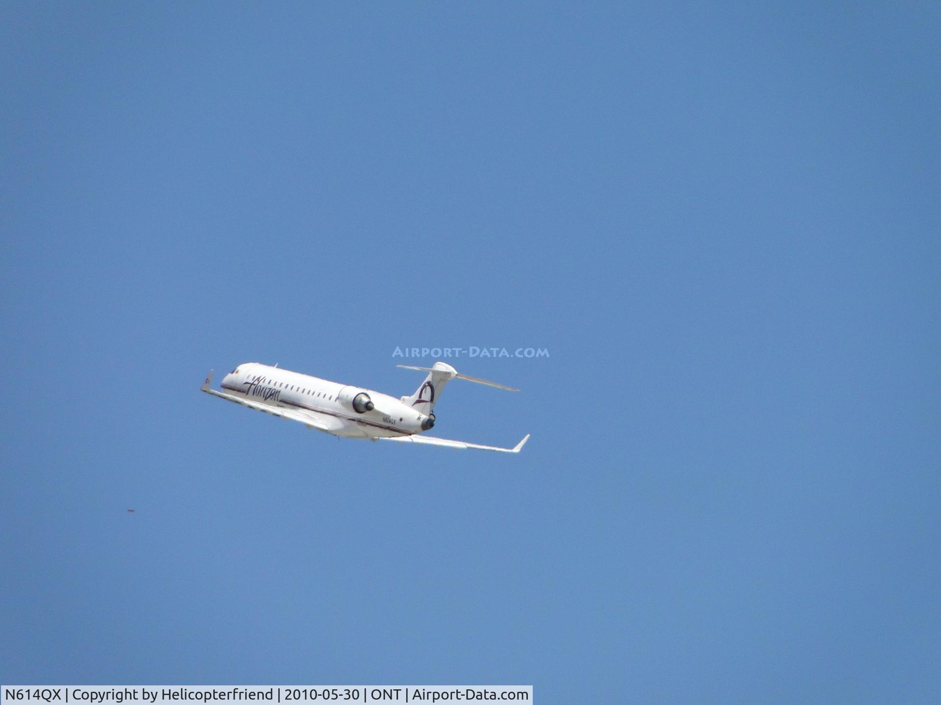 N614QX, 2002 Bombardier CRJ-701 (CL-600-2C10) Regional Jet C/N 10049, Climbing out from runway 26R heading west