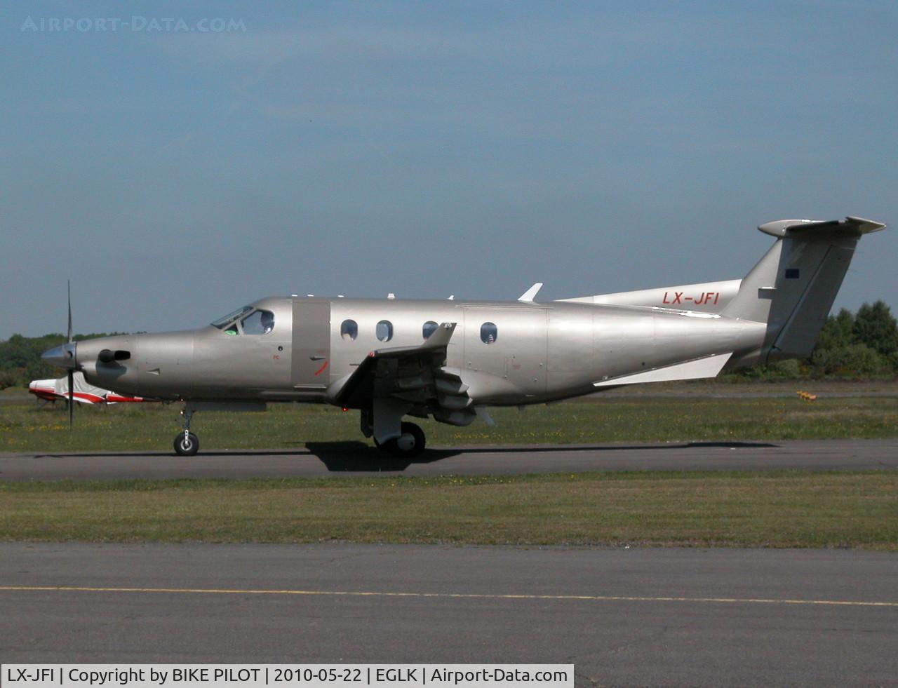 LX-JFI, 2004 Pilatus PC-12/45 C/N 574, DRAB LOOKING PC-12 TAXYING PAST THE CAFE