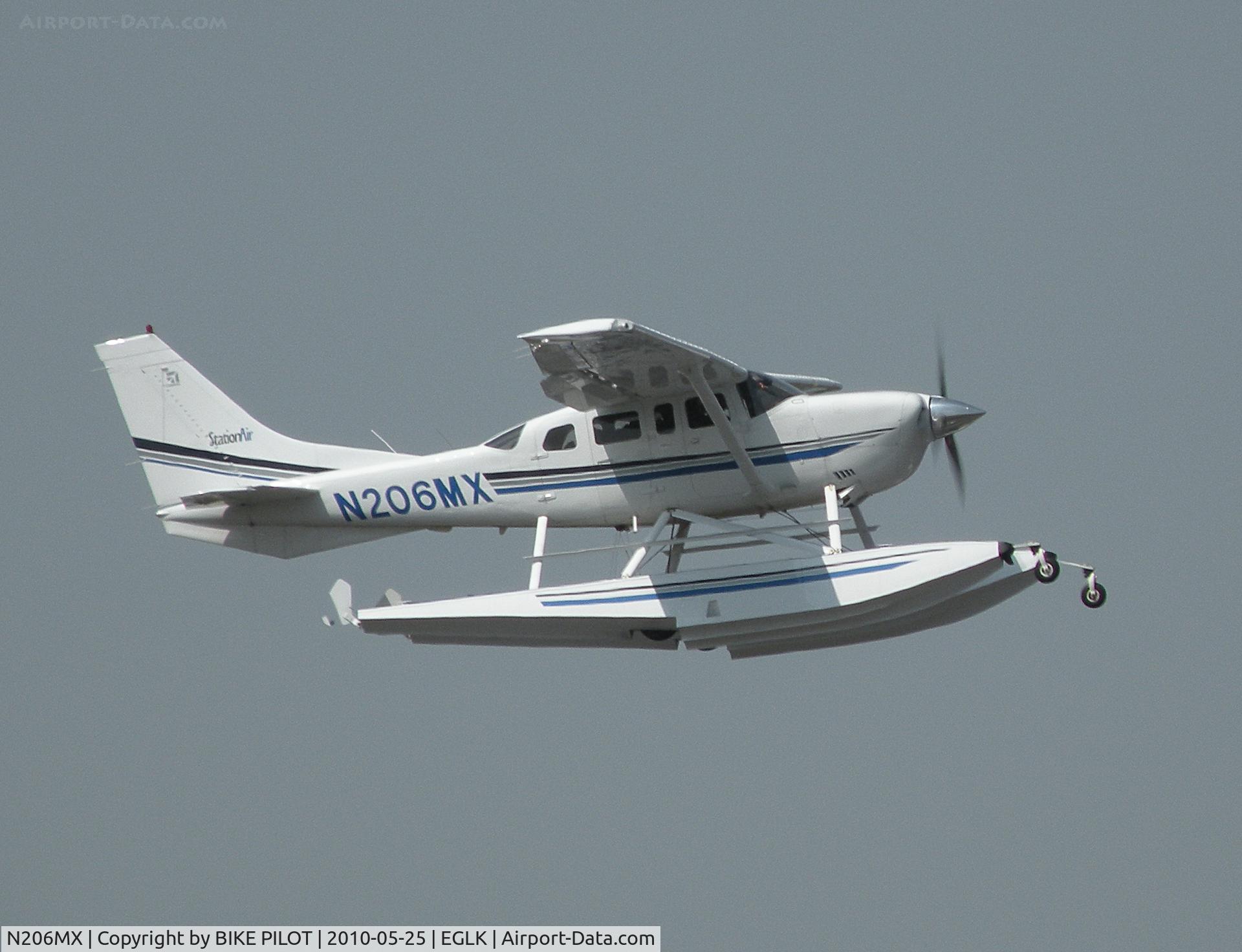 N206MX, 2001 Cessna 206H Stationair C/N 20608149, STATIONAIR CLIMBING FROM RWY 25.