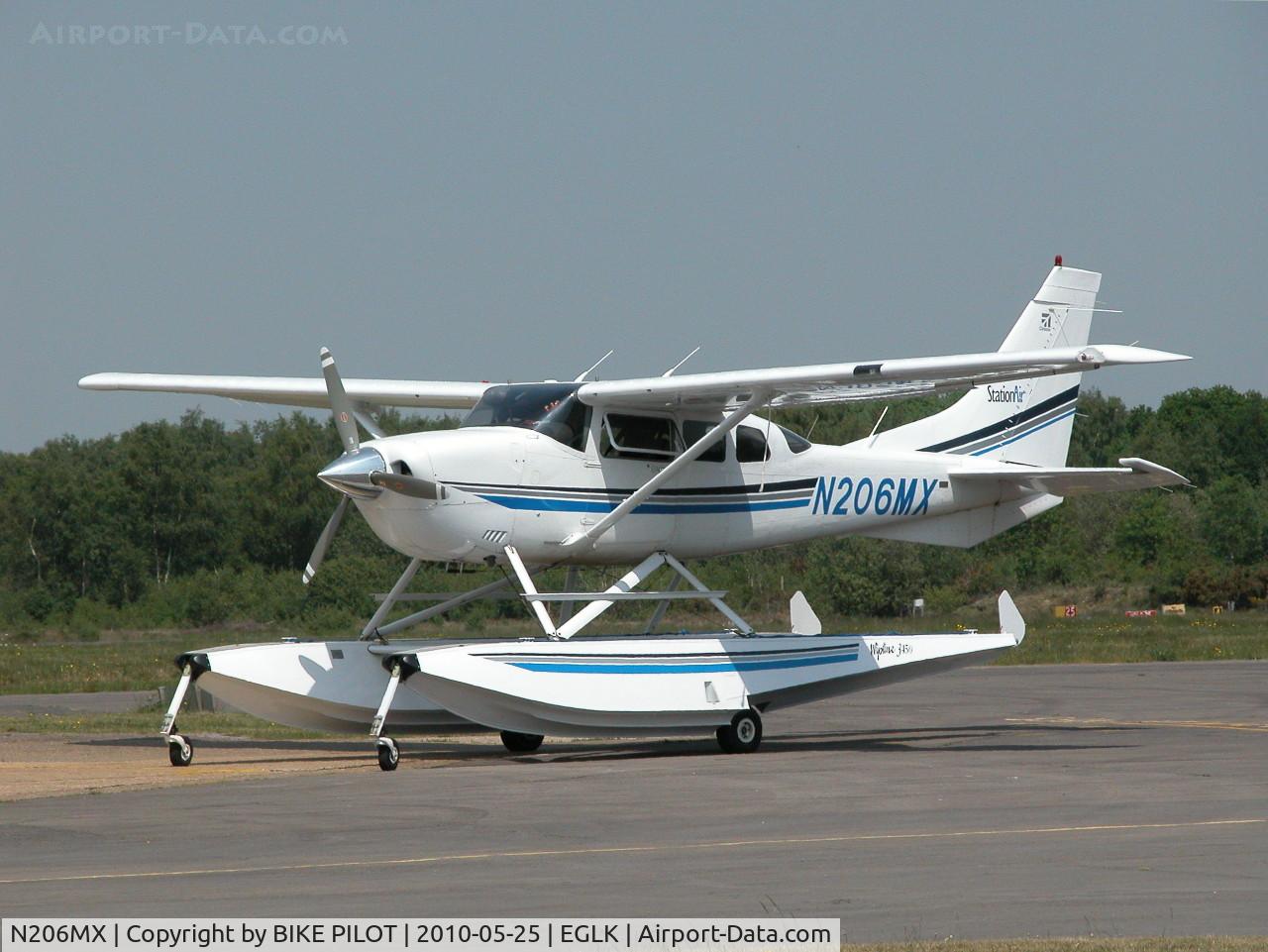 N206MX, 2001 Cessna 206H Stationair C/N 20608149, NICE VISITOR WAITING NEAR THE PUMPS