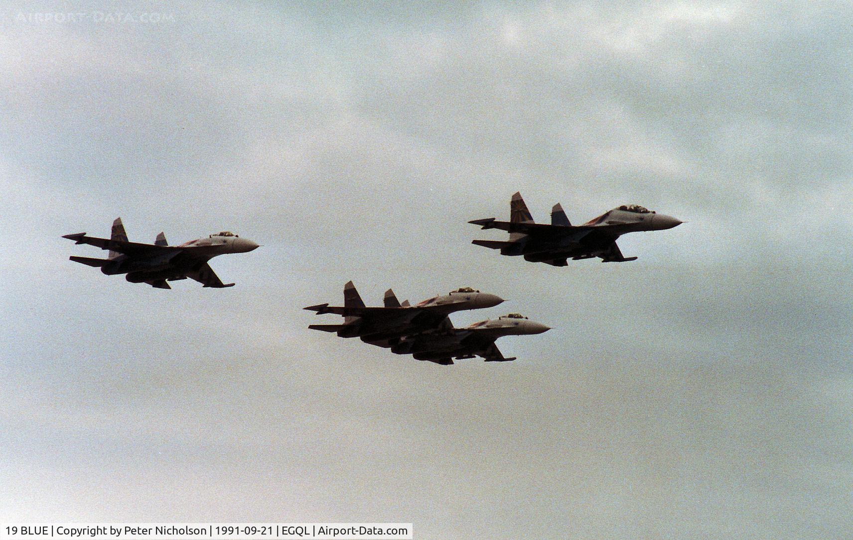 19 BLUE, Sukhoi Su-27UB C/N 1040807, Flanker C leading three Flanker A's of the Russian Knights display team at the 1991 RAF Leuchars Airshow.