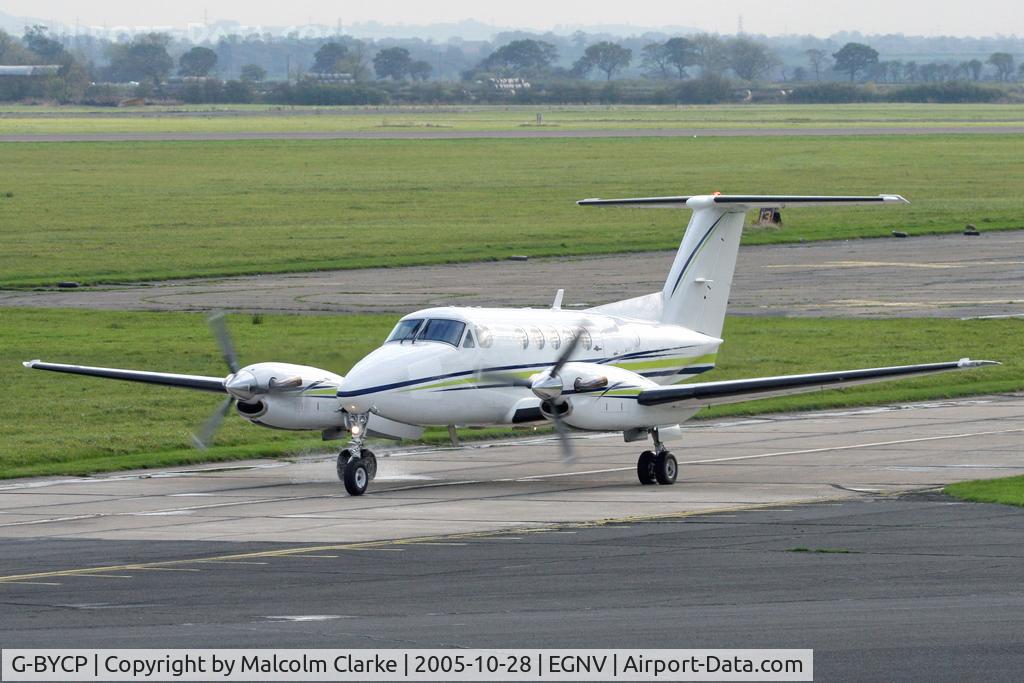 G-BYCP, 1981 Beech B200 Super King Air King Air C/N BB-966, Beech B200 Super King Air on the taxi way to 23 for take-off at Durham Tees Valley Airport in 2005.