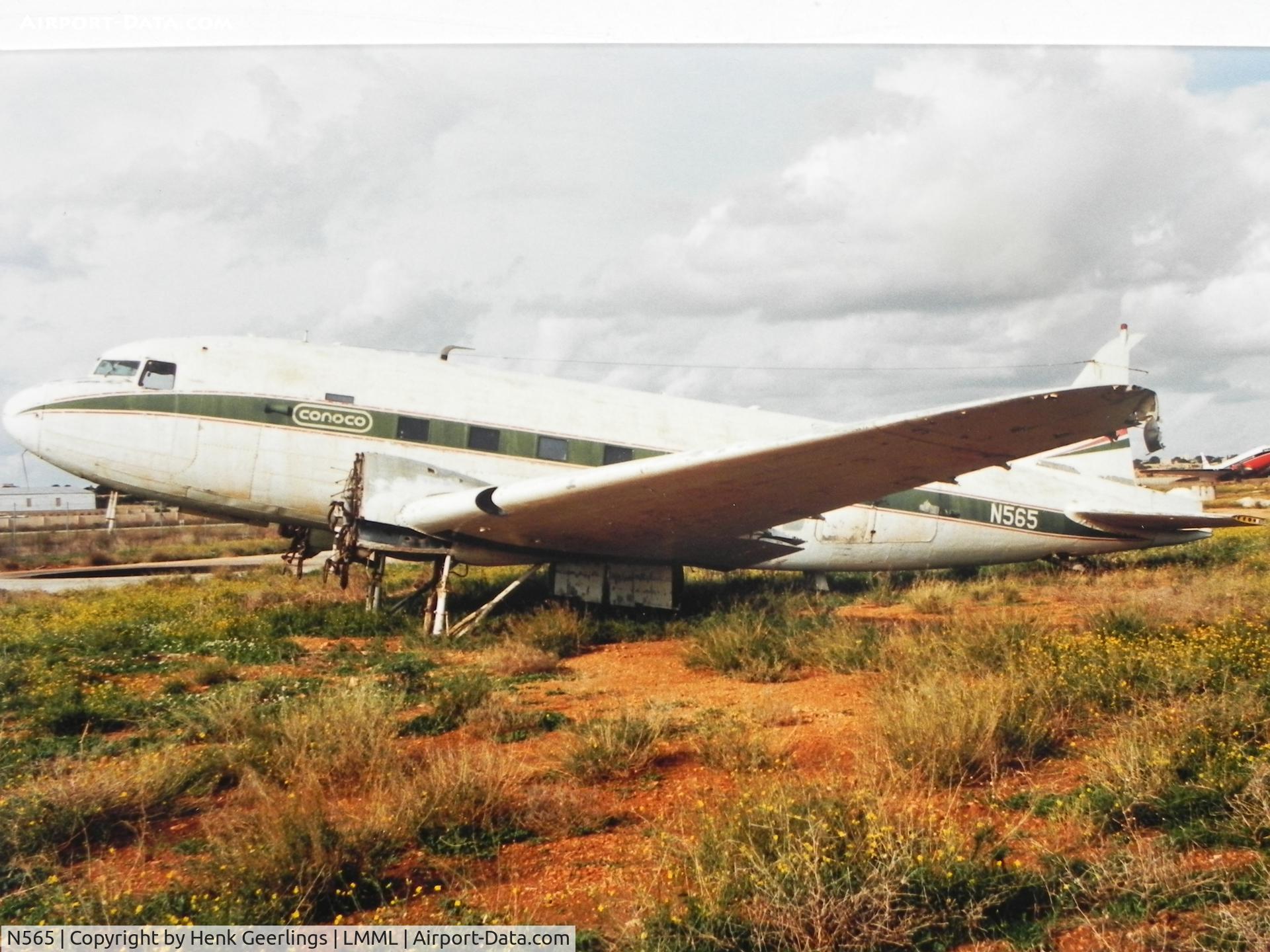 N565, 1944 Douglas C-47B-10-DK (DC-3C) C/N 26400, Conoco Company , Old Luqa Airport at Malta.    Scan taken from photo taken in Nov. 1987