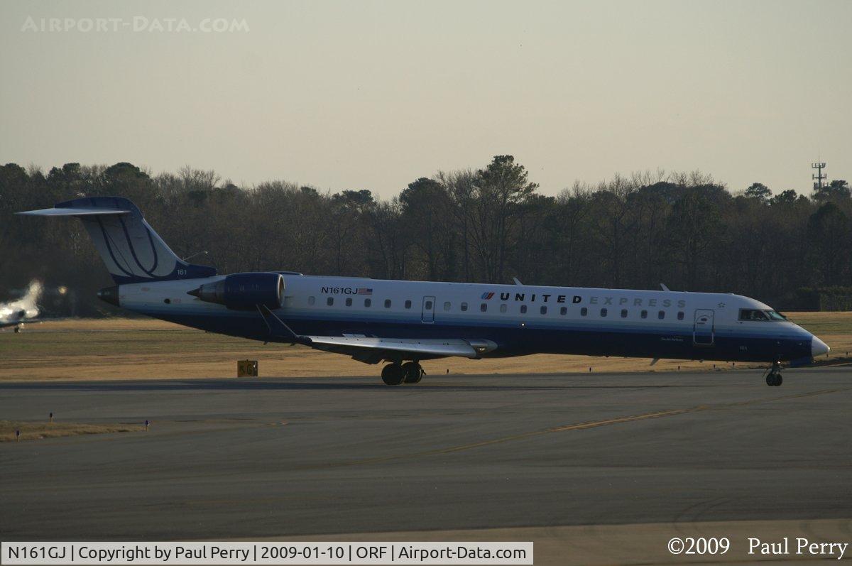 N161GJ, 2006 Bombardier CRJ-550 (CL-600-2C11) C/N 10253, Headed for the terminal as the sun dips lower