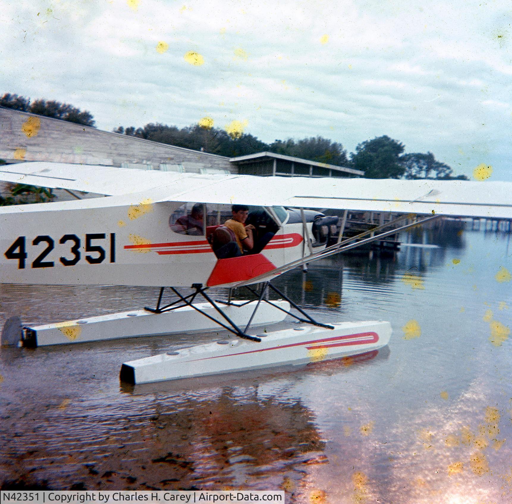 N42351, 1945 Piper J3C-65 Cub Cub C/N 14601, At Lake Iola, Florida, 1968, pilot and owner Tom McCabe in rear seat, passenger Norman Carey in front seat.
