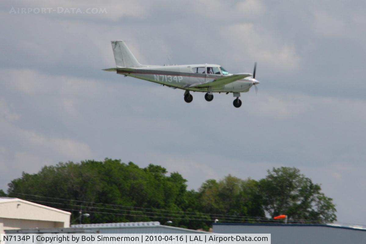N7134P, 1960 Piper PA-24-250 Comanche C/N 24-2299, Arriving at Lakeland, Florida during Sun N Fun 2010.