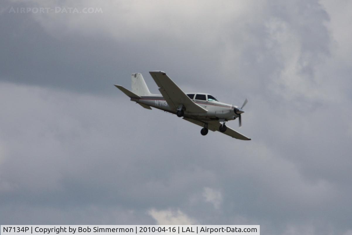 N7134P, 1960 Piper PA-24-250 Comanche C/N 24-2299, Arriving at Lakeland, Florida during Sun N Fun 2010.