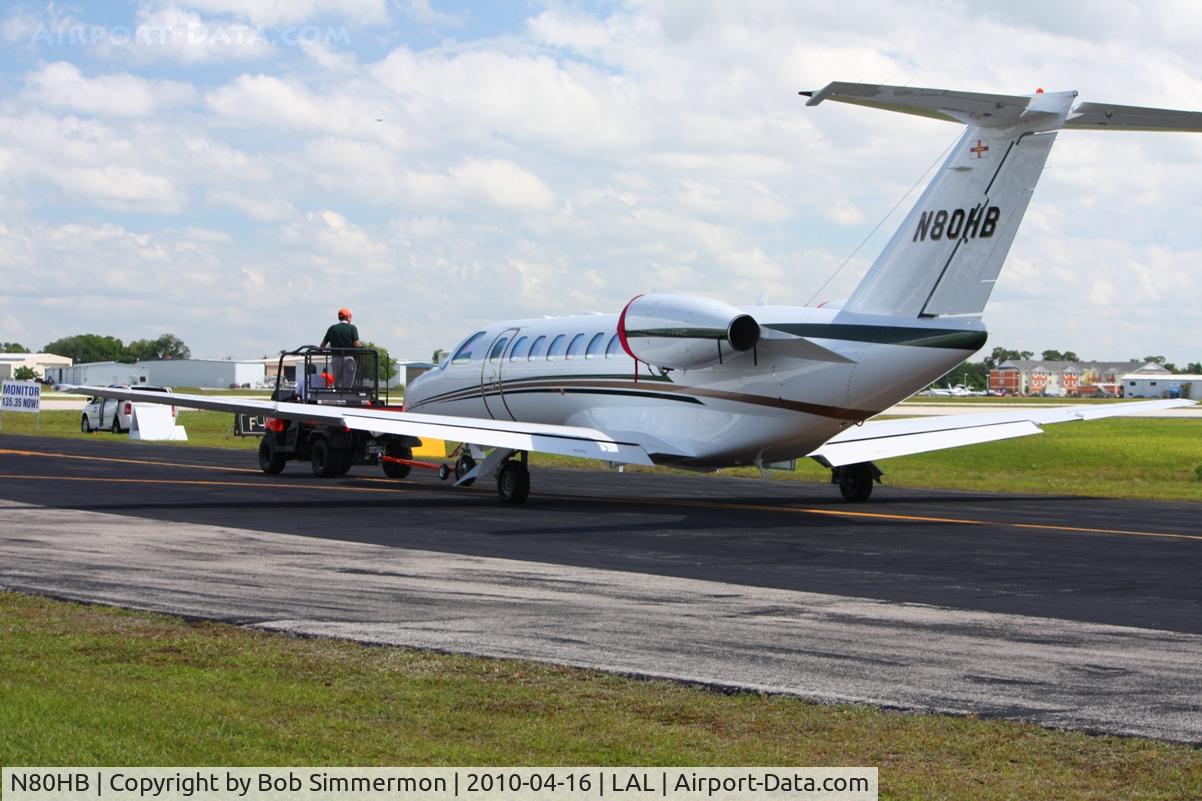 N80HB, 2007 Cessna 525B CitationJet CJ3 C/N 525B-0163, In tow across the field at Lakeland, Florida during Sun N Fun 2010.