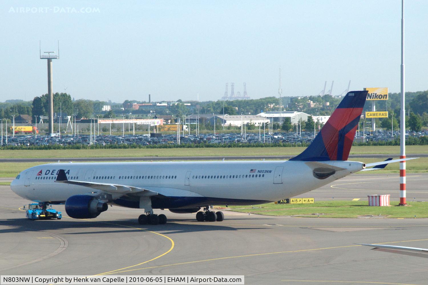 N803NW, 2003 Airbus A330-323 C/N 0542, Being towed across Schiphol this A330 recently changed livery from Northwest Airlines to Delta Air Lines.