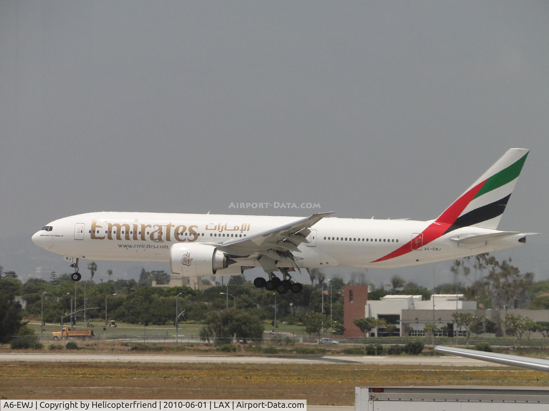 A6-EWJ, 2009 Boeing 777-21H/LR C/N 35590, Landing on runway 24R